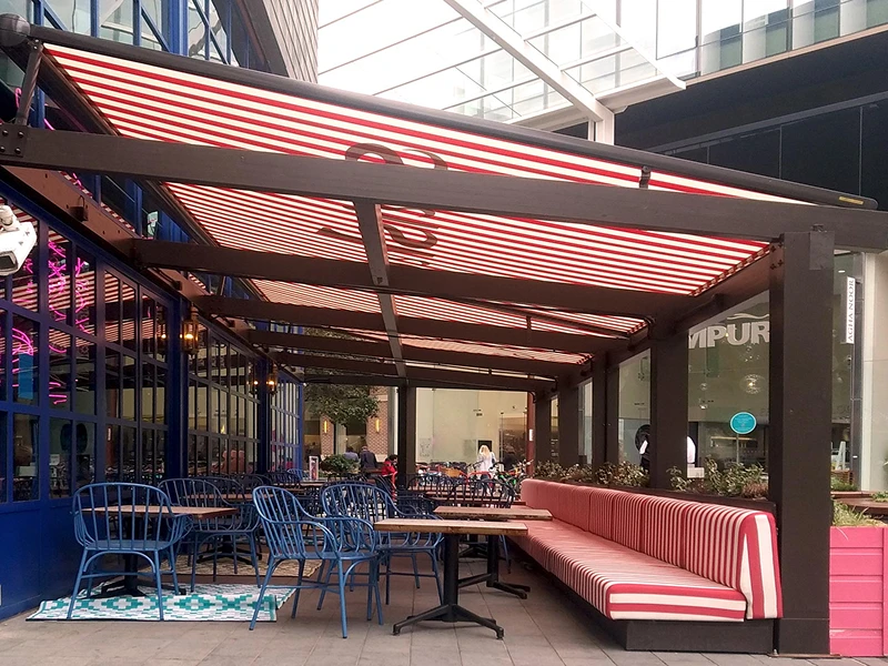 Business patio in San Antonio with custom commercial awning providing customer comfort