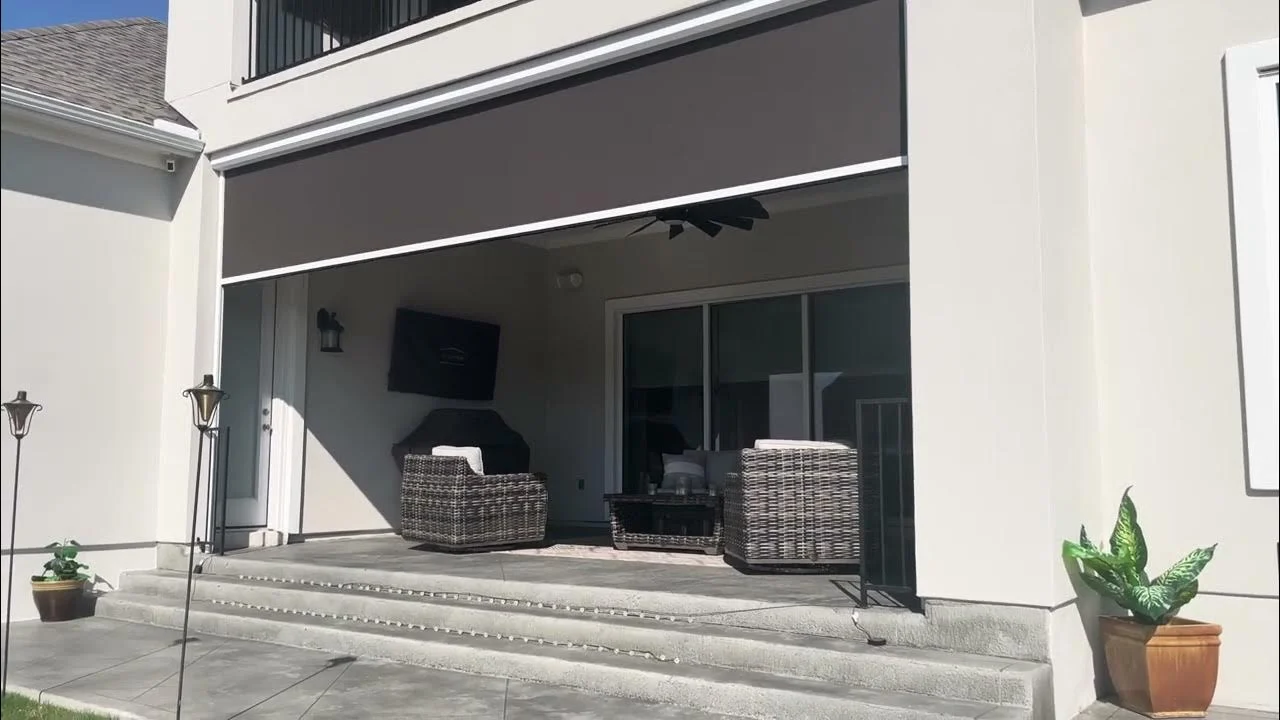 Motorized retractable awning on Texas home providing hands‑free shade