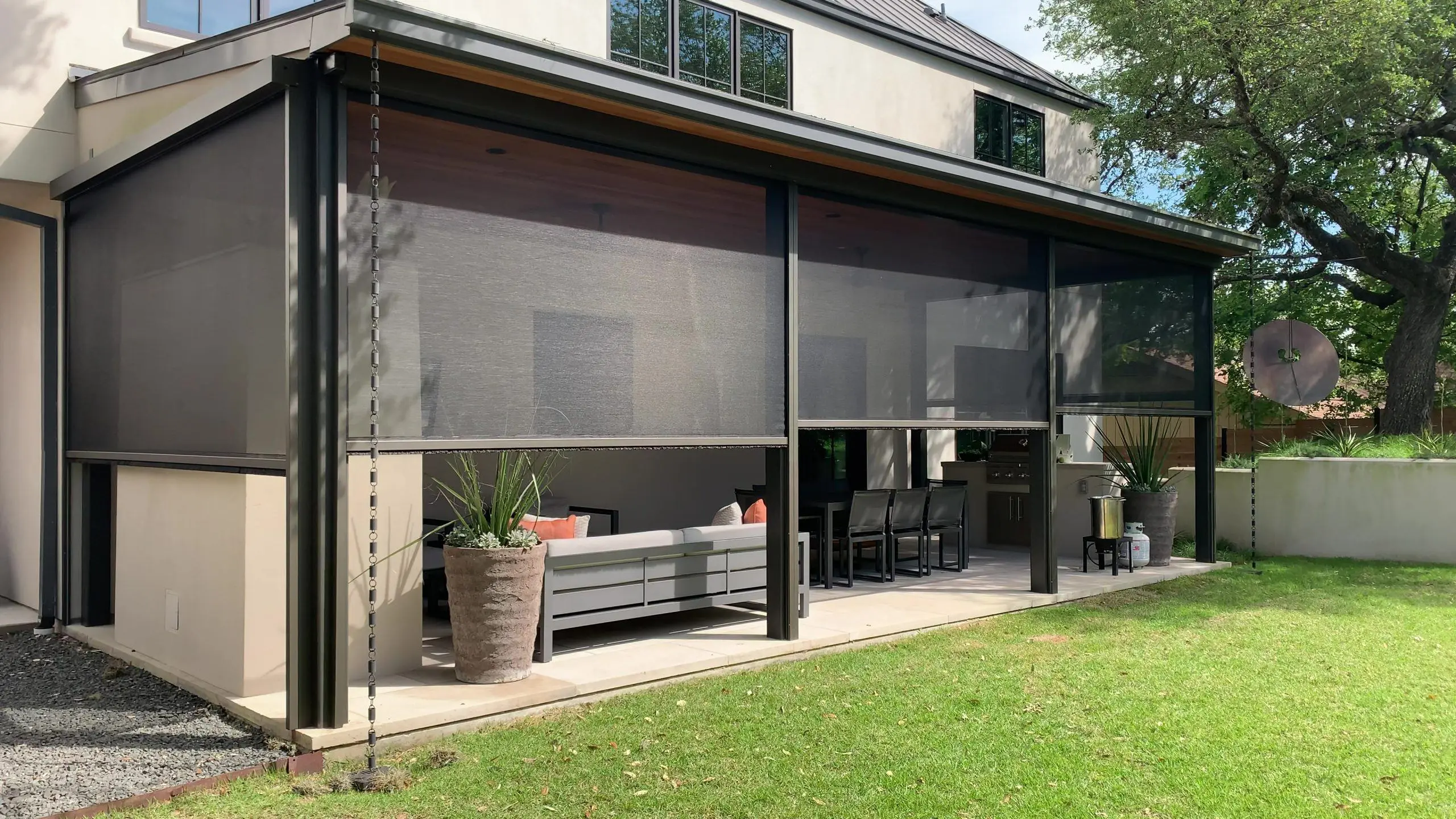 San Antonio patio enclosed with motorized screens blocking sun and insects